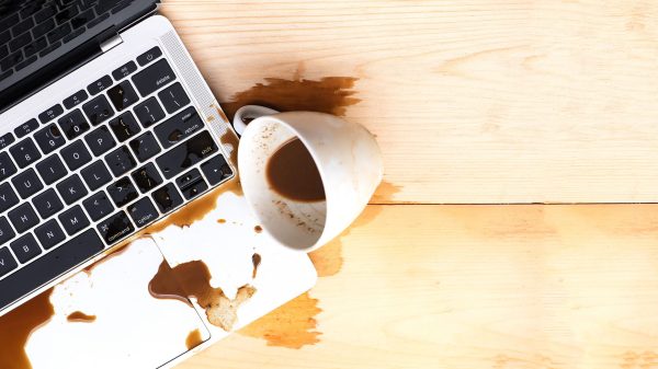 Coffee,Spilled,Into,A,Computer,Notebook