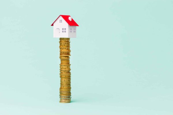 Little,House,On,A,Pile,Of,Coins.