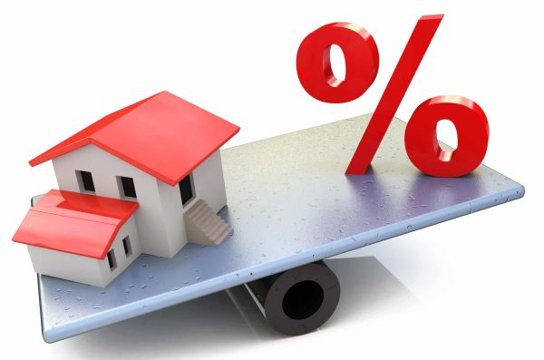 Seesaw,With,Percent,Symbol,And,A,House,,Isolated,On,White