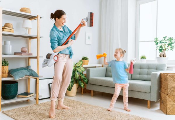Happy,Family,Vacuuming,The,Room.,Mother,And,Daughter,Doing,The